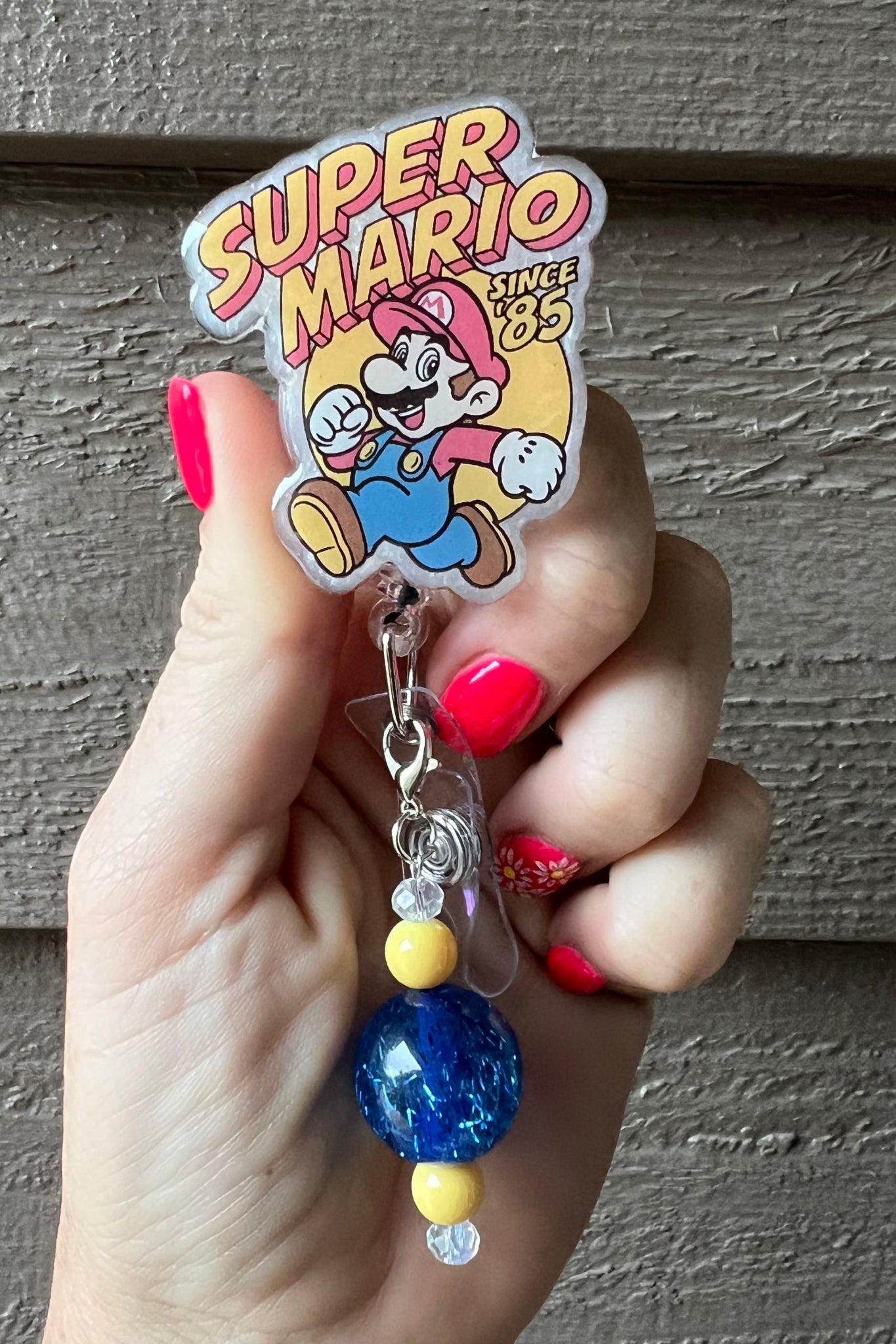 Super Mario Badge Reel with Pearl background and coordinating badge bling.