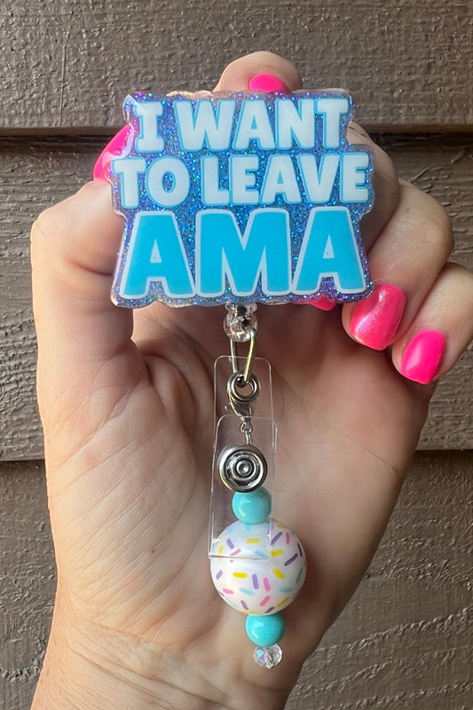 Funny Badge reel with "I want to leave AMA" text on a glittery blue background, featuring a sprinkle-patterned and turquoise beaded dangle.