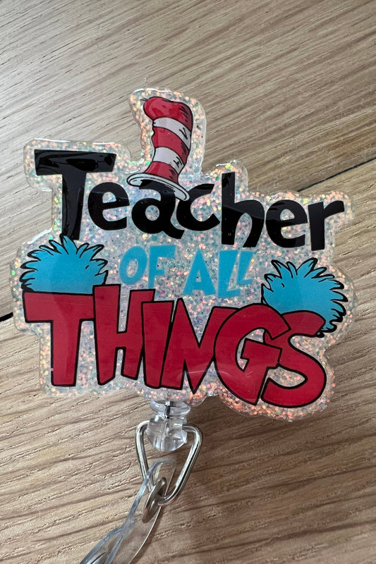 Cat in the hat inspired badge reel that says "Teacher of all things"