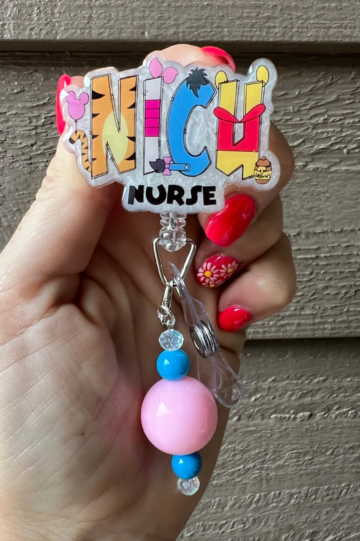 NICU Nurse Badge Reel with Winnie the Pooh characters in the NICU letters over pearl background with matching badge bling.