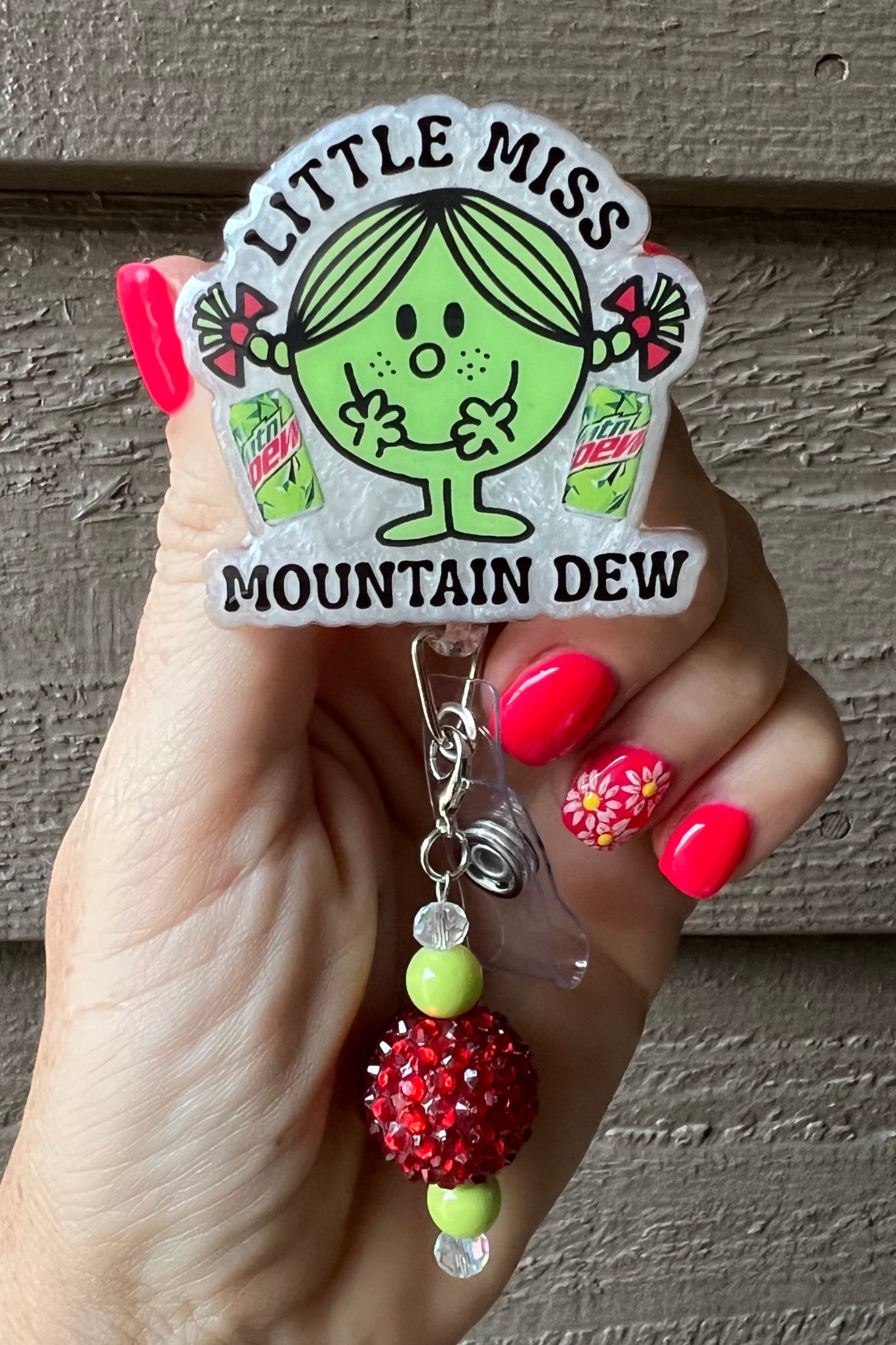 Little Miss Mountain Dew Badge Reel on white pearl background with coordinating badge bling.