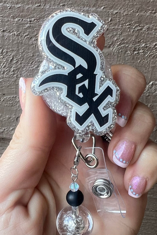 Glittery White Sox badge reel with black and clear beaded dangle