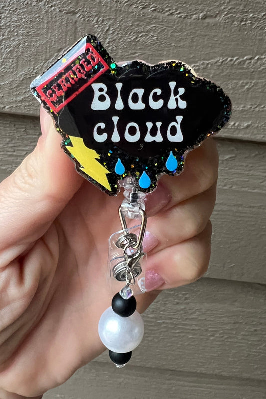 Badge Reel shaped like a storm cloud with the words "Black Cloud" and a red "CERTIFIED" label, plus coordinating badge bling.
