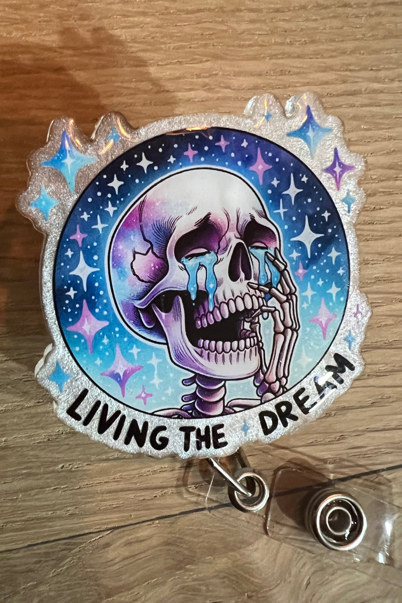 Living the Dream – Funny Crying Skeleton Badge Reel with Cosmic Sparkle with Free Badge Bling!
