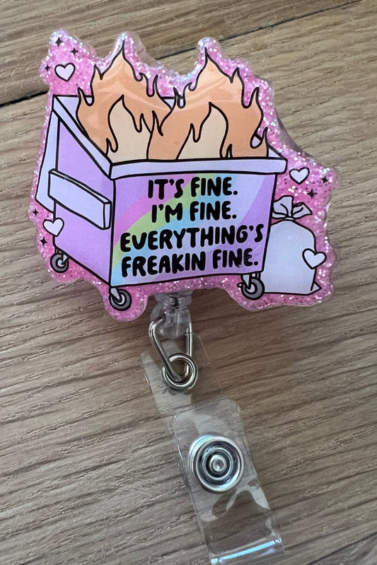 Funny pink glitter dumpster fire badge reel that says “It’s fine. I’m fine. Everything’s freakin’ fine.”