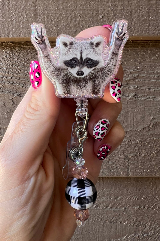 Rocking raccoon badge reel with soft sparkle border and coordinating badge bling.