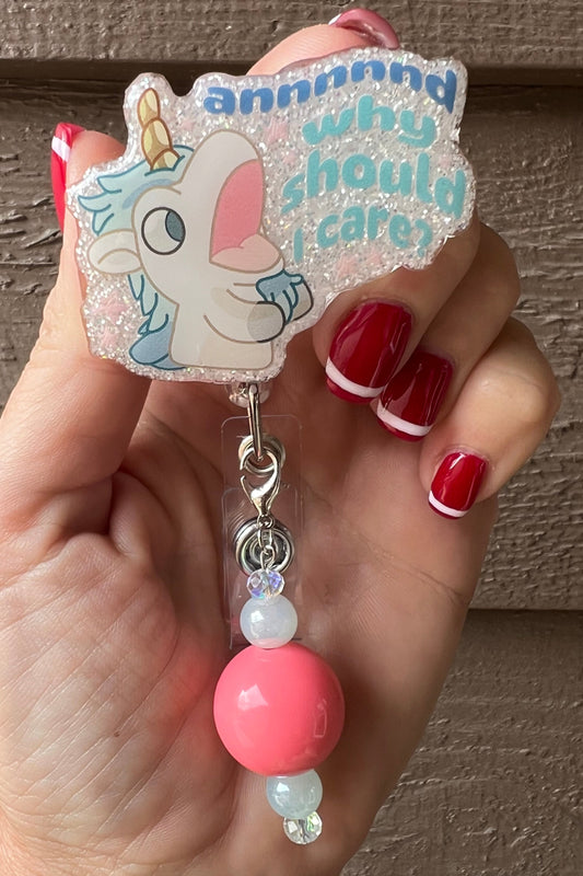 Open Mouthed Unicorse from Bluey and the phrase "annnnnnd why should I care?" over soft glitter and coral beaded dangle.