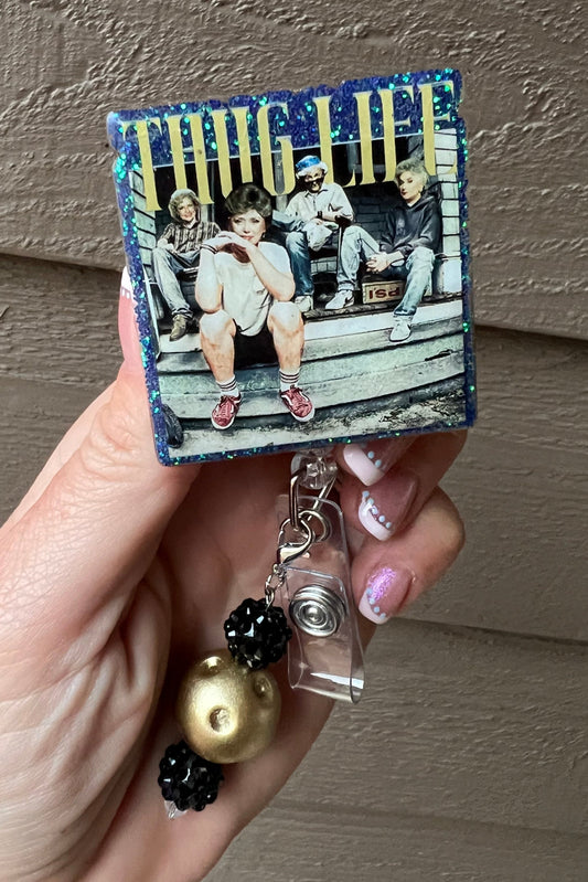 Funny badge reel with Golden Girls in a thug life theme, sitting on a porch with green glitter trim

